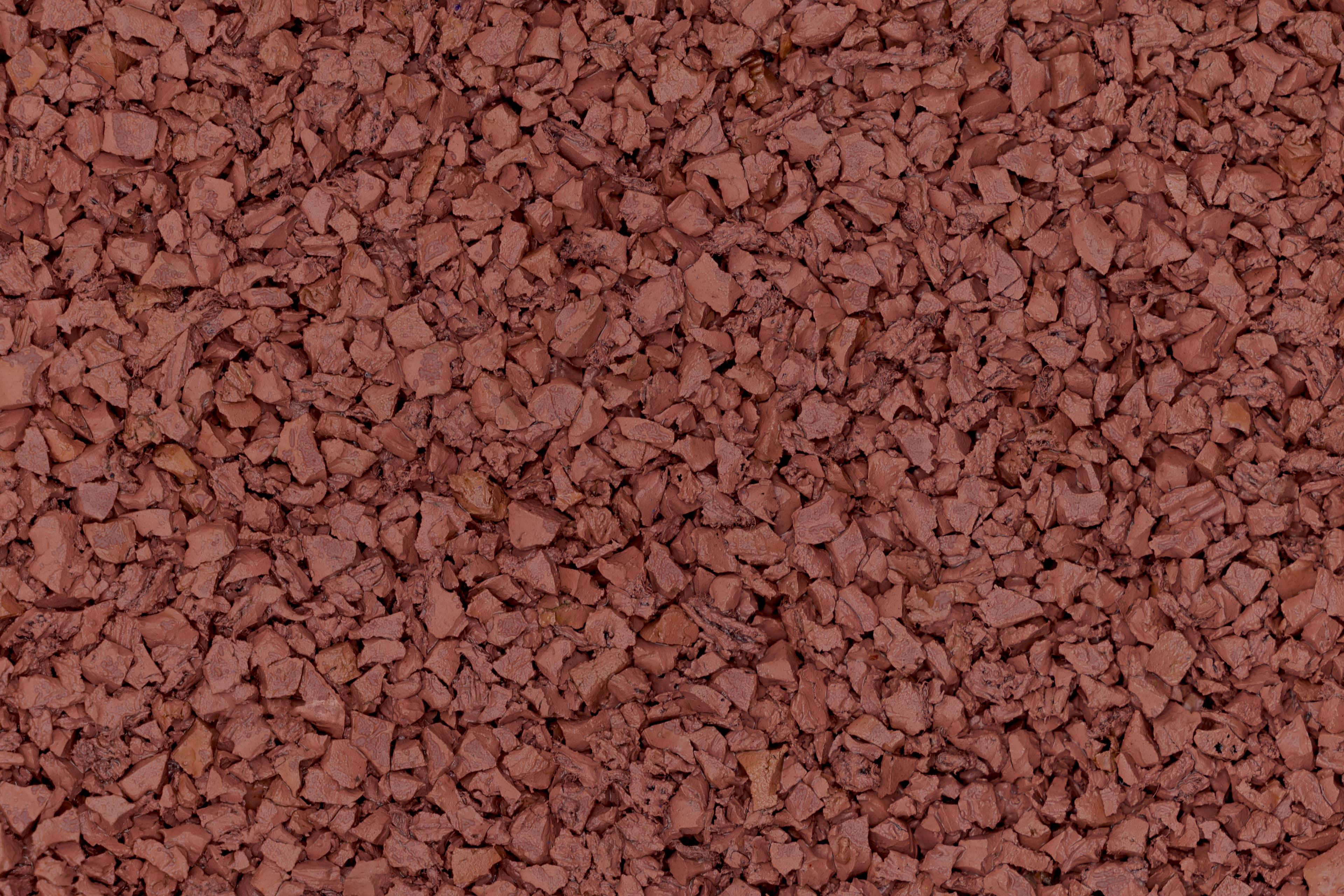 Розовая резиновая крошка